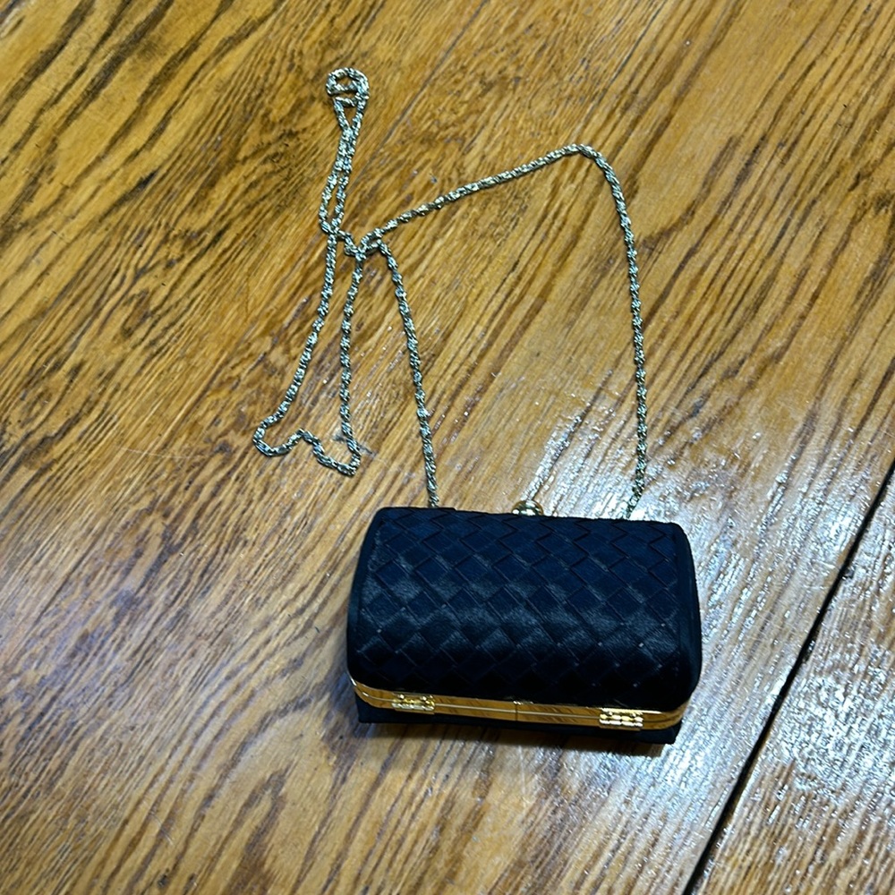 Black vintage satin basket weave evening bag with gold chain.  Good condition.